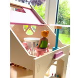 Wooden dollhouse with furniture set